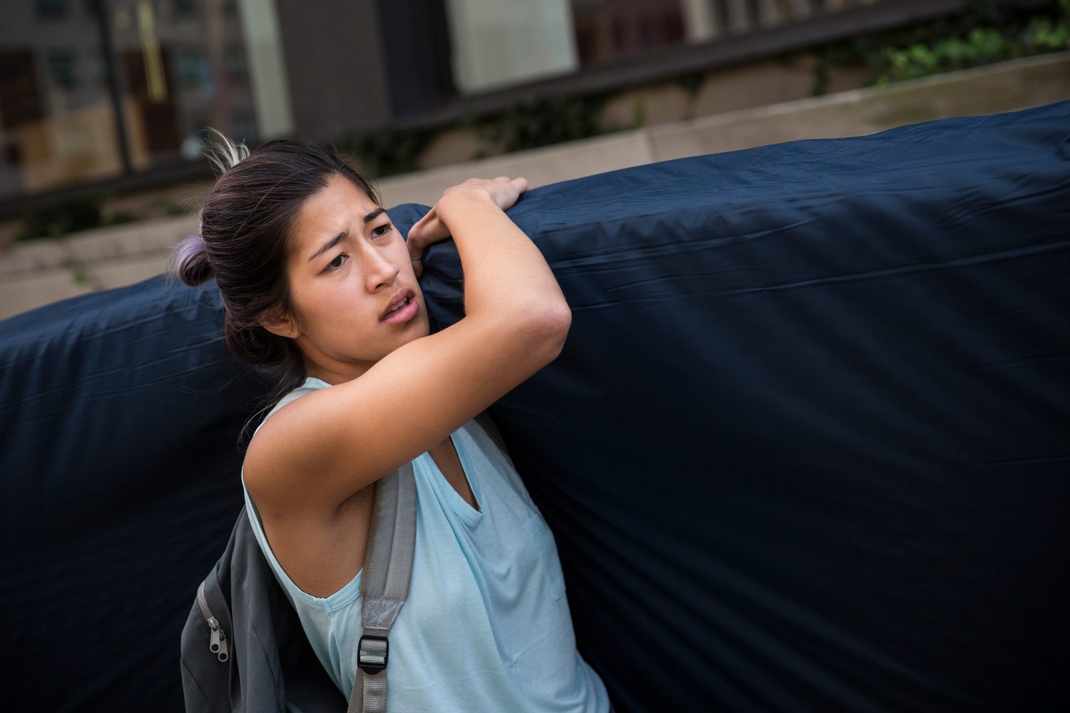 NEW YORK, NY - SEPTEMBER 05:  Emma Sulkowicz, a senior visual arts student at Columbia University, carries a mattress in protest of the universitys lack of action after she reported being raped during her sophomore year on September 5, 2014 in New York City. Sulkowicz has said she is committed to carrying the mattress everywhere she goes until the university expels the rapist or he leaves. The protest is also doubling as her senior thesis project.  (Photo by Andrew Burton/Getty Images)