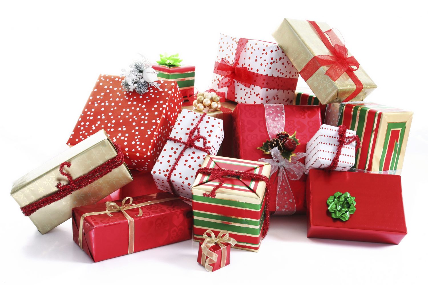 A pile of Christmas gifts in colorful wrapping with ribbons.