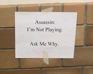Assassin Opposers Put Up Signs, Supporters Tear Down