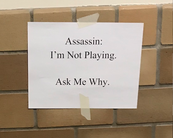 Assassin Opposers Put Up Signs, Supporters Tear Down