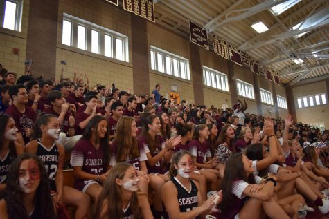 Students cheer on varsity sports team. Photo credit: Maroon Staff