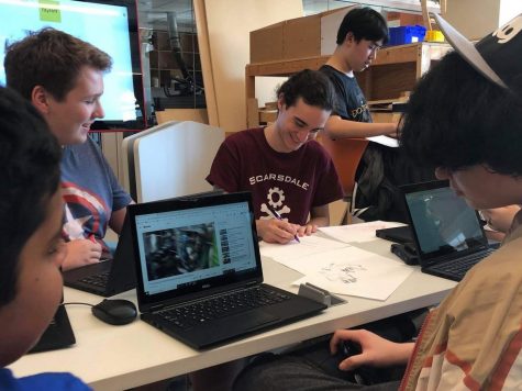 Members of the Robo Raiders brainstorm new designs. The Robotics Club is one of many extracurriculars advancing STEM knowledge at SHS.