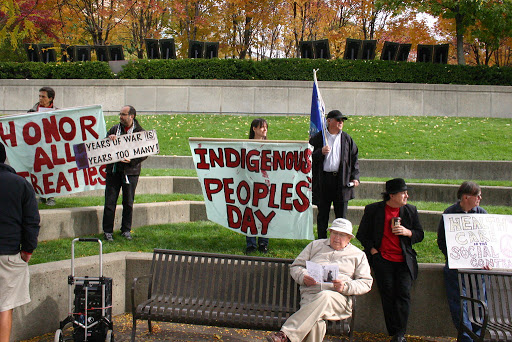 People protesting the celebration of Christopher Columbus, and professing to refer to the holiday as “Indigenous Peoples’ Day”.