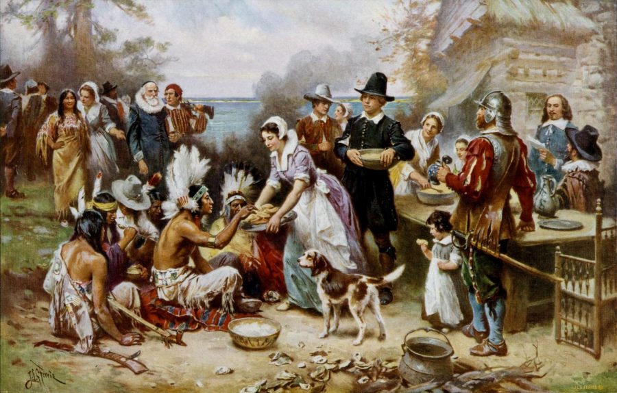 A scene from the first thanksgiving in 1612. The Wampanoags and the Pilgrims share the harvest. 