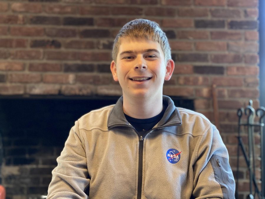 Wolf Cukier ’20, proudly sporting his NASA apparel in his home here in Scarsdale. The SHS senior has plans to continue his studies in astrophysics next September when he starts college. 
