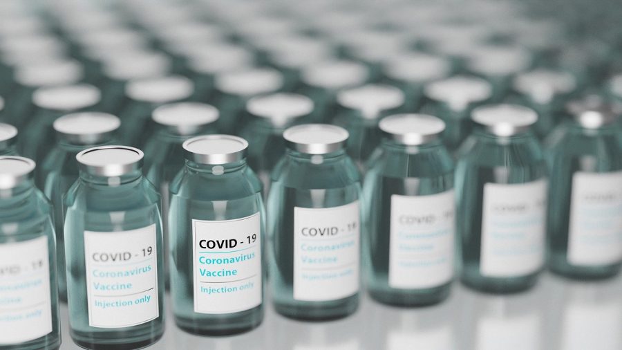 Vials of COVID-19 vaccine lined up to be used by injection.