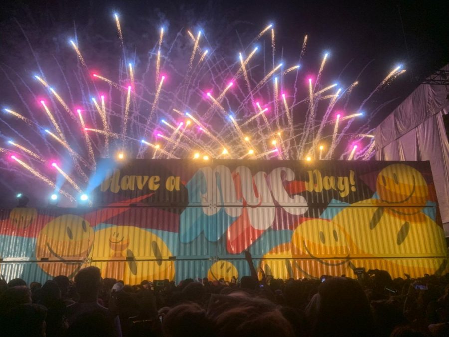 Behind graphic art on multiple cargo crates, fireworks from the Grubhub stage close J Balvin’s performance. 