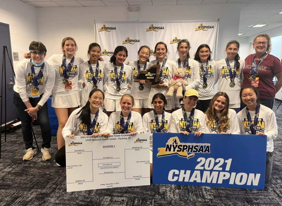 The Girls’ Varsity Tennis team wins the NYSPHSAA championships.