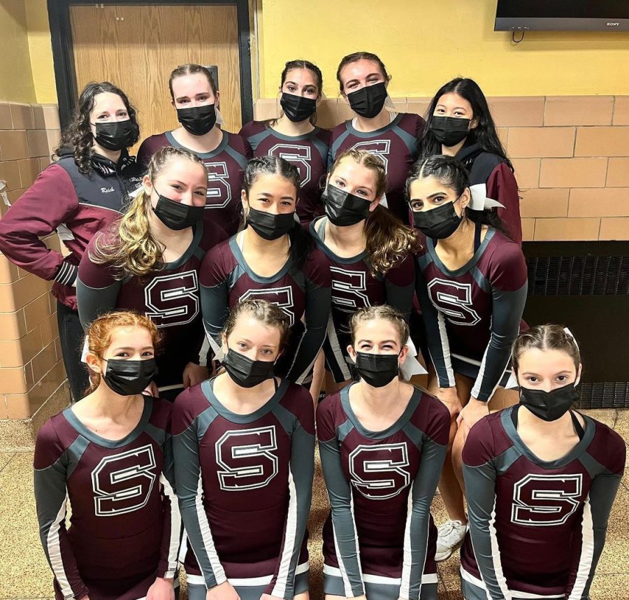 The+Scarsdale+cheerleading+team+poses+for+a+picture+before+their+competition+at+regionals.