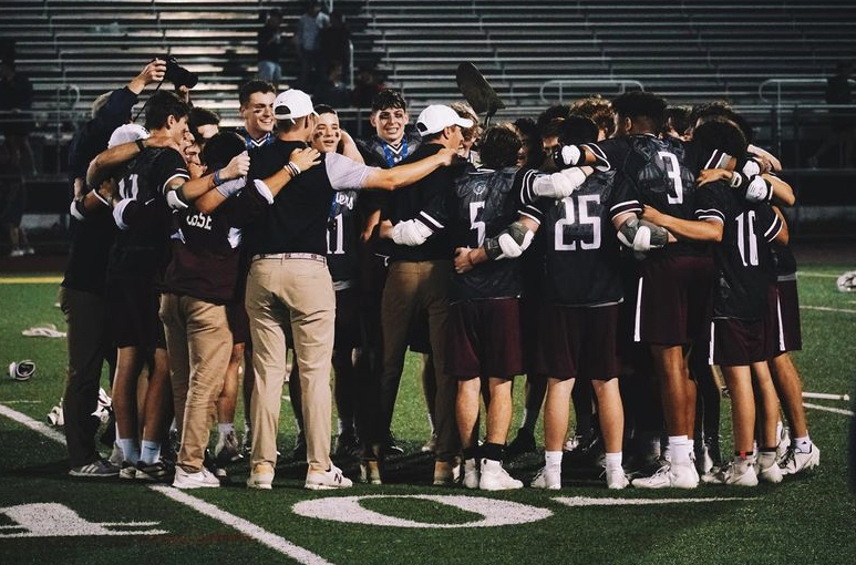 The SHS Boys Varsity Lacrosse team celebrates their second straight section title.