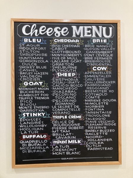 Dobbs & Bishop has a lengthy menu displaying all of the cheese varieties for sale. The list includes cheeses from goats, cows, and sheep!