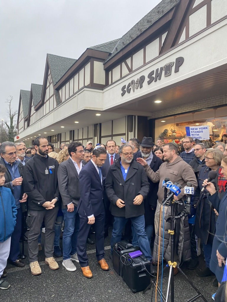 Scarsdale and New Rochelle residents meet in front of Scoop Shop.