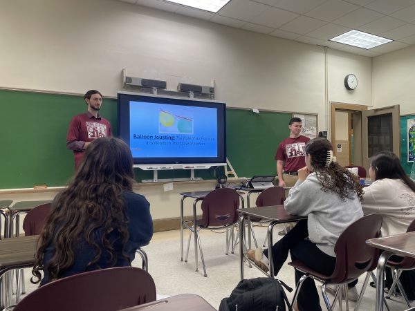 Chemistry teacher Andrew Visconti and Physics teacher Kevin Anton presenting their “Balloon Jousting” Pi Day activity.