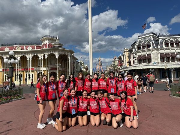 Cheerleaders from the Varsity and JV teams posed together at Walt Disney World during their trip to UCA National.