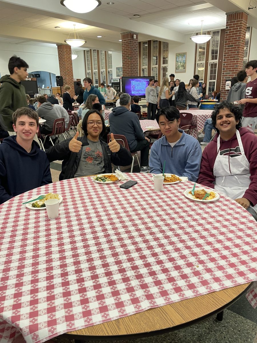 SHS students enjoy the variety of delicious food offered at the community dinner.