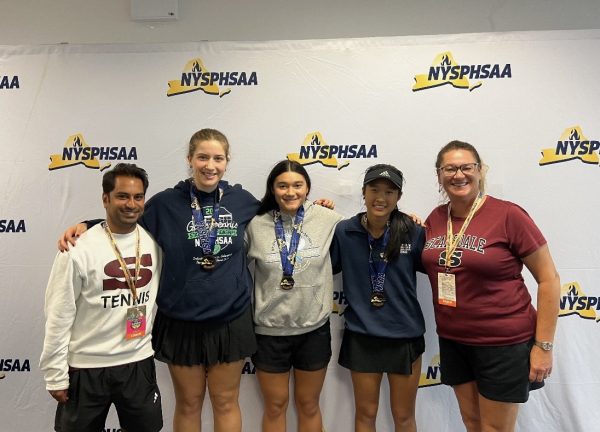 The Scarsdale Girls Varsity Tennis Team at the state championships. Pictured from left to right: Coach Michael Kumaresan, Kay Cottrell, Giana Marks, Isabel Lin, Coach Jennifer Roane