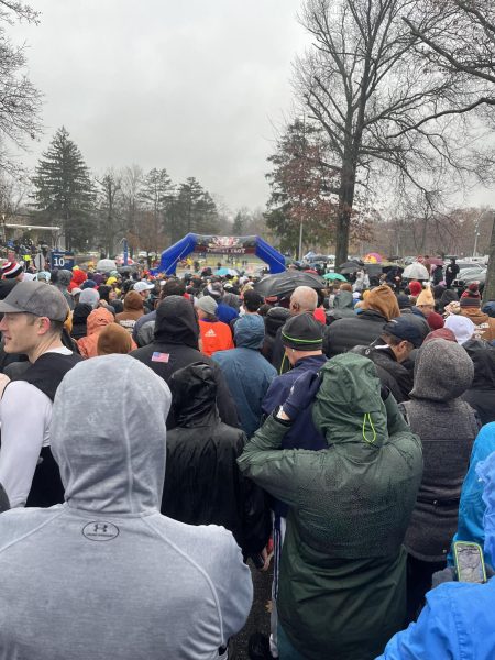 Families gather for a turkey trot at Westchester Community College in the rain.