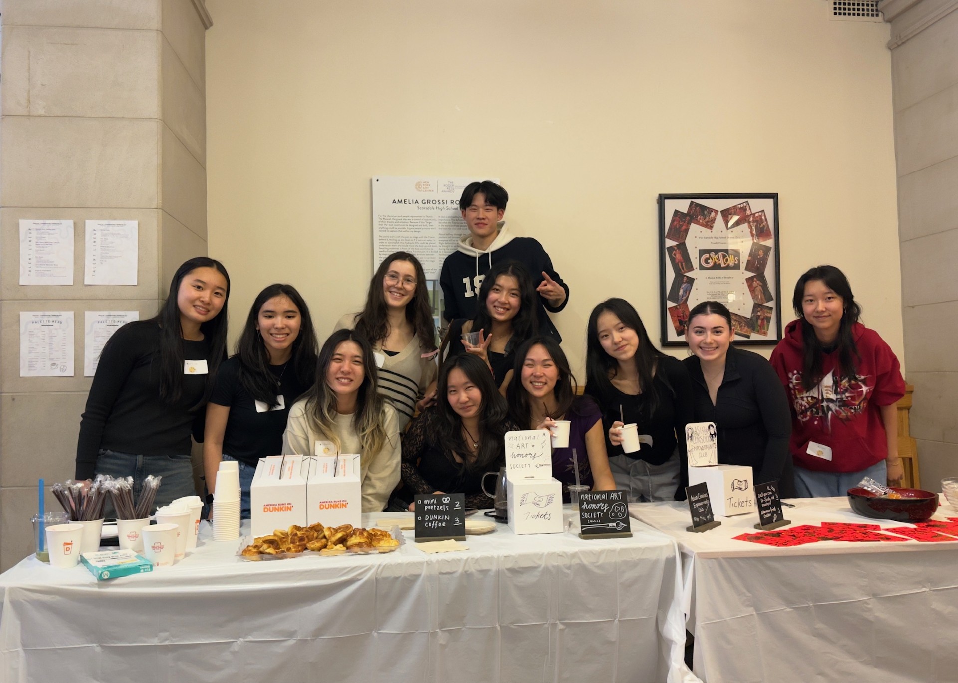 Members of the National Art Honors Society who organized the event posing at their booth.