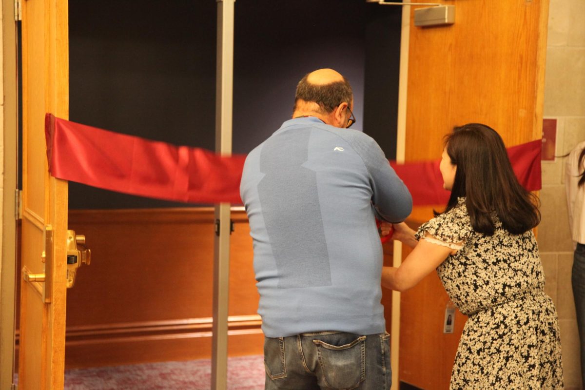 Members of the Scarsdale Board of Education cut the ribbon during the inauguration ceremony for SHS' renovated auditorium. 