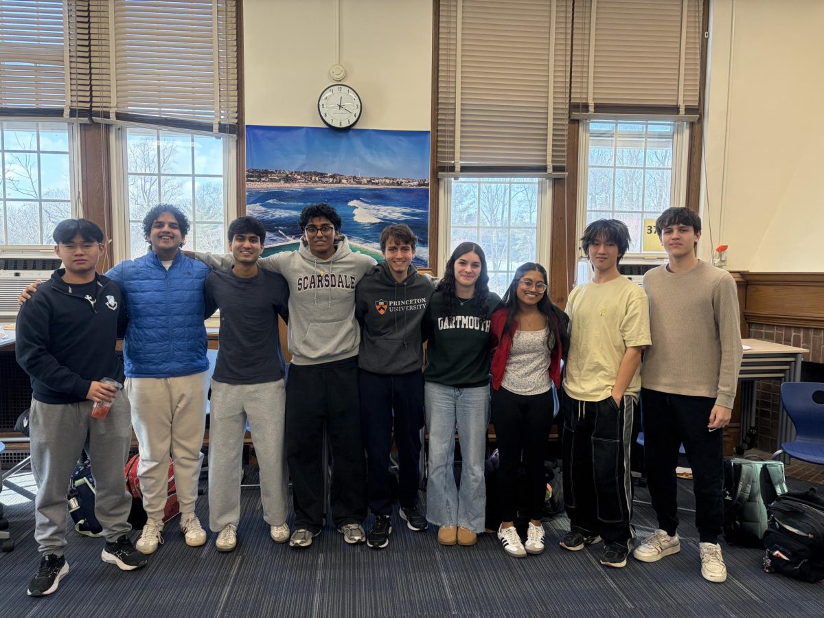 School government officers pose at the end of their last house meeting together. 