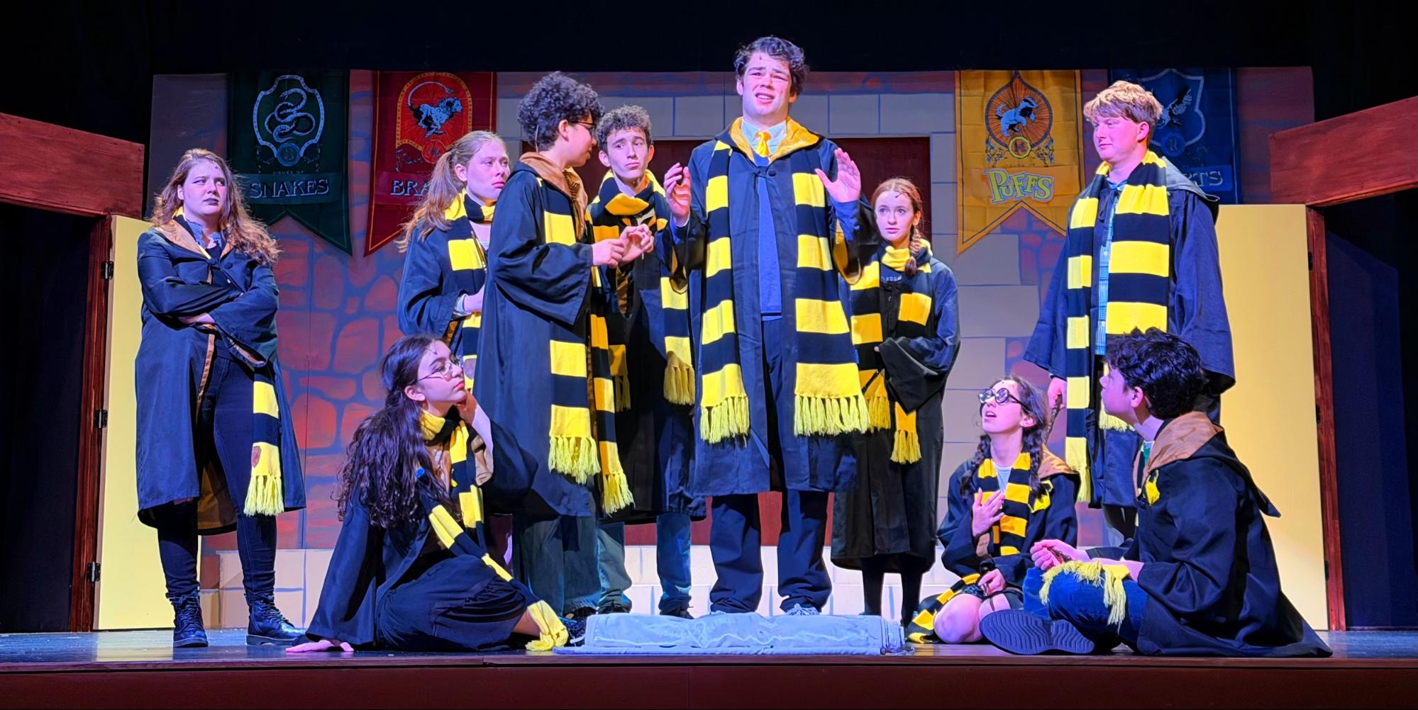 Cedric Diggory (Peter Robelen '27) is lauded and admired by the Hufflepuffs, showcasing his role as the much-praised hero of the original Harry Potter.
